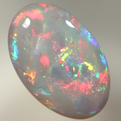 SOLID SEMI BLACK OPAL Bright crisp rolling flashes. Fire red, neon yellow, green and blue